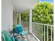 Private balcony with comfy seating and lush foliage at 608 Columbus Dr, Tierra Verde, FL 33715