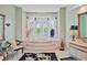 Large bathroom with a luxurious soaking tub and separate shower at 608 Columbus Dr, Tierra Verde, FL 33715
