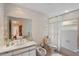 Bathroom with tiled walls, bathtub, toilet and vanity at 608 Columbus Dr, Tierra Verde, FL 33715