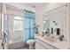 Clean bathroom with a tub, toilet, and vanity at 608 Columbus Dr, St Petersburg, FL 33715