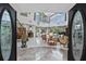 Elegant two-story entryway with double doors and marble floors at 608 Columbus Dr, Tierra Verde, FL 33715