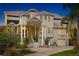 Luxury home with grand entrance and manicured landscaping at 608 Columbus Dr, Tierra Verde, FL 33715