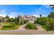 Beautiful home with circular driveway and manicured lawn at 608 Columbus Dr, Tierra Verde, FL 33715