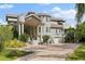 Large home with a covered entryway and stately columns at 608 Columbus Dr, Tierra Verde, FL 33715