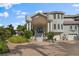 Elegant home with grand entrance, columns and paved driveway at 608 Columbus Dr, Tierra Verde, FL 33715