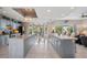 Spacious kitchen with island, stainless steel appliances, and ample cabinet space at 608 Columbus Dr, Tierra Verde, FL 33715