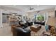 Relaxing living room with leather furniture and sliding doors to patio at 608 Columbus Dr, Tierra Verde, FL 33715