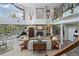 Living room with a fireplace and two-story ceilings at 608 Columbus Dr, Tierra Verde, FL 33715