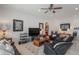 Spacious living room with a large TV, comfortable seating, and decorative accents at 608 Columbus Dr, Tierra Verde, FL 33715