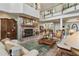 Open living room with high ceilings and a fireplace at 608 Columbus Dr, Tierra Verde, FL 33715
