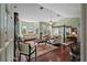 Luxurious main bedroom with a four-poster bed, sitting area, and hardwood floors at 608 Columbus Dr, Tierra Verde, FL 33715