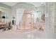 Large walk-in shower with glass enclosure and pink tile at 608 Columbus Dr, Tierra Verde, FL 33715