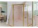 Large walk-in shower with glass enclosure and pink tile at 608 Columbus Dr, Tierra Verde, FL 33715