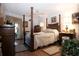 Main bedroom with large bed, dresser, and access to balcony at 6472 Seagull Dr # 303, Bradenton, FL 34210