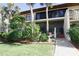 Two-story building with a walkway and landscaping at 6472 Seagull Dr # 303, Bradenton, FL 34210