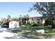 Condo building with parking and mature trees at 6472 Seagull Dr # 303, Bradenton, FL 34210