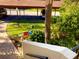 Landscaped garden with a bird feeder and walkway at 6472 Seagull Dr # 303, Bradenton, FL 34210