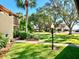Landscaped garden with lush greenery and a pathway at 6472 Seagull Dr # 303, Bradenton, FL 34210
