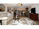 Spacious living room with comfy seating and large TV at 6472 Seagull Dr # 303, Bradenton, FL 34210