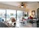 Bright sunroom with wicker furniture and view of trees at 6472 Seagull Dr # 303, Bradenton, FL 34210
