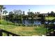 View of waterfront property with lush landscaping at 6472 Seagull Dr # 303, Bradenton, FL 34210