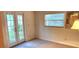 Bedroom with french doors opening to backyard at 6773 14Th N Ave, St Petersburg, FL 33710