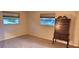 Empty bedroom with two windows and carpeted floor at 6773 14Th N Ave, St Petersburg, FL 33710