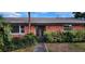 Front view of a brick house with a walkway and landscaping at 6773 14Th N Ave, St Petersburg, FL 33710