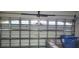 Garage interior with automatic door and storage at 6773 14Th N Ave, St Petersburg, FL 33710