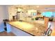Kitchen with granite countertops, white cabinets, and a breakfast bar at 6773 14Th N Ave, St Petersburg, FL 33710