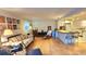 Living room with hardwood floors and a view into the kitchen at 6773 14Th N Ave, St Petersburg, FL 33710