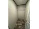 Well-lit closet featuring wire shelving and wood-look flooring at 7337 Desant Ln, Port Charlotte, FL 33981