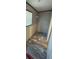 Small walk-in closet with wood-look floors at 7337 Desant Ln, Port Charlotte, FL 33981
