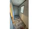 Small walk-in closet with wood-look floors at 7337 Desant Ln, Port Charlotte, FL 33981