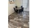 Small dining area with four chairs and wood-look floors at 7337 Desant Ln, Port Charlotte, FL 33981