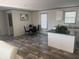 Open kitchen with island and dining area at 7337 Desant Ln, Port Charlotte, FL 33981