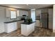 Modern kitchen with island and stainless steel appliances at 7337 Desant Ln, Port Charlotte, FL 33981