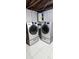 Bright basement laundry room with washer and dryer at 9116 Chantilly Ln, Port Richey, FL 34668