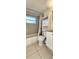 Clean bathroom with tub shower, toilet and vanity at 9116 Chantilly Ln, Port Richey, FL 34668