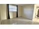 Bright bedroom with tile floors and window coverings at 9116 Chantilly Ln, Port Richey, FL 34668
