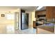 Kitchen with stainless steel appliances and wood cabinets at 9116 Chantilly Ln, Port Richey, FL 34668
