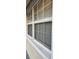 White window with blinds and screen at 9116 Chantilly Ln, Port Richey, FL 34668