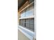White window with blinds and screen at 9116 Chantilly Ln, Port Richey, FL 34668