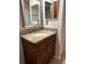Bathroom features granite vanity and updated sink and faucet fixtures at 9760 Lake Seminole E Dr, Largo, FL 33773