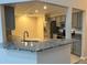 Modern kitchen with stainless steel appliances and granite countertops at 9760 Lake Seminole E Dr, Largo, FL 33773