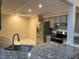 Modern kitchen with stainless steel appliances and granite countertops at 9760 Lake Seminole E Dr, Largo, FL 33773