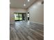 Spacious living room with sliding glass doors leading to the patio at 9760 Lake Seminole E Dr, Largo, FL 33773