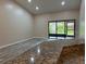 Spacious living room with sliding glass doors leading to the patio at 9760 Lake Seminole E Dr, Largo, FL 33773