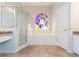 Bathroom with a shower, tub, and stained-glass window at 23635 Oakside Blvd, Lutz, FL 33559