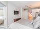 Main bedroom with a large TV and access to the pool at 23635 Oakside Blvd, Lutz, FL 33559